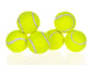 A group of bright yellow tennis balls stacked for use with interactive dog toys.
