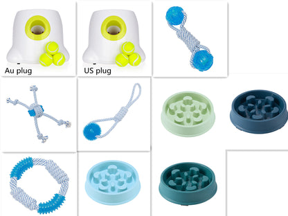 Automatic dog ball launcher with attachments for interactive dog toys, including plugs and various toys.